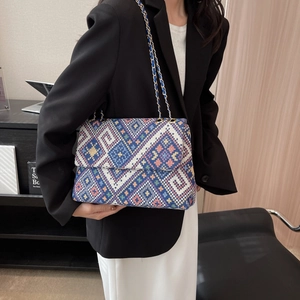 Ethnic geometric canvas handbag with colorful weaving and gold chain strap for women
