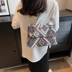 Ethnic embroidery canvas handbag with colorful geometric patterns and chain strap