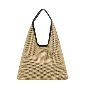 Retro woven straw tote bag with black leather shoulder straps for beach vacations