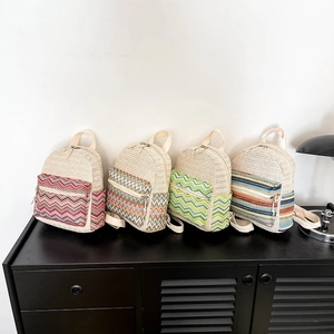 Ethnic straw woven backpacks featuring bohemian geometric patterns and zipper closures