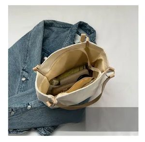 Top view of the spacious canvas tote bag interior with multiple functional compartments