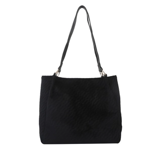 Large black quilted tote bag with wave stitching and gold hardware for women