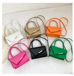 Flat lay of colorful crocodile pattern mini square bags in six stylish vibrant shades