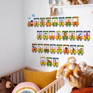 Detail of colorful animal alphabet train wall stickers in a cozy nursery room setting