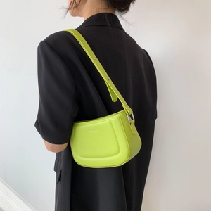 Minimalist lime green leather shoulder bag for women with adjustable strap and silver buckle