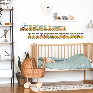 Detail of educational alphabet animal train wall stickers in a modern nursery room setting