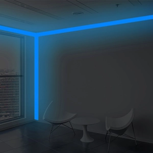 Blue luminous self-adhesive tape installed on ceiling edges for indoor decorative glow
