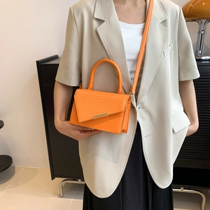 Bright orange crocodile embossed leather small square bag with golden metal trim for women