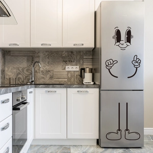 Autocollants de frigo cartoon créatifs avec de grands yeux et des mains sur un frigo argent