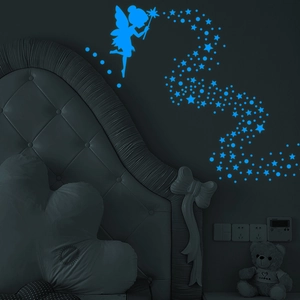 Luminous blue fairy and starry sky wall stickers glowing in a dark bedroom
