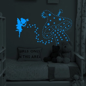 Glow-in-the-dark wall stickers with blue fluorescent fairy and star patterns in bedroom