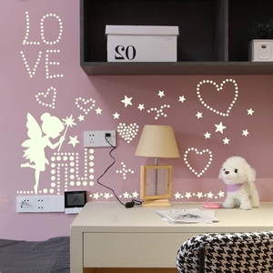 Detail of glow-in-the-dark wall stickers featuring fairy, stars, and heart patterns