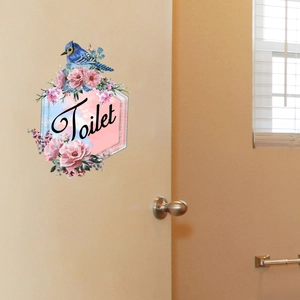 Floral wall sticker with a blue bird and Toilet text on a hexagonal bathroom door sign