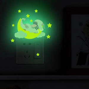 Glow-in-the-dark wall sticker featuring a cute elephant sleeping on a crescent moon and stars