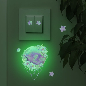 Luminous mermaid fairy wall sticker showing glowing floral planet and stars near a switch
