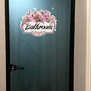 Floral Bathroom wall sticker featuring pink roses and artistic script lettering on a door