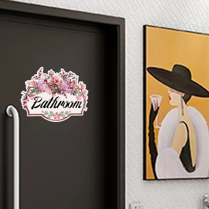 Floral bathroom door decal featuring pink flowers and elegant black script lettering