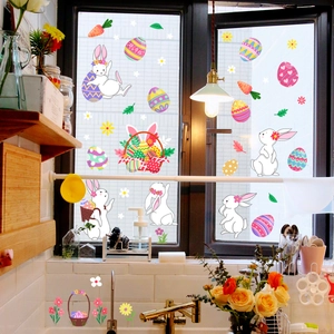 Easter static window clings showing cartoon bunnies and eggs on a kitchen glass window