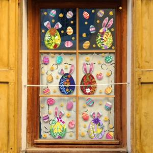 Detailed Easter window stickers with colorful floral eggs and bunny ears on glass