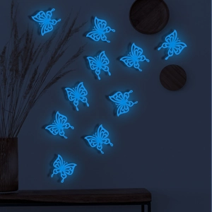 Detailed view of 10 glowing 3D hollow butterfly wall stickers in ice blue luminescence