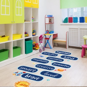 Close-up of blue educational floor stickers with brave and smart words for kids rooms