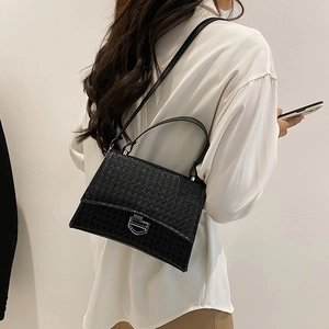 Chic black woven texture crossbody bag with silver shield buckle and leather strap