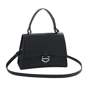 Minimalist black woven texture crossbody bag with silver buckle and top handle