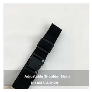 Detail of adjustable black nylon shoulder strap with matte plastic buckle for chest bag