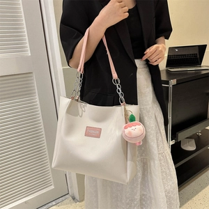 Large capacity white PU leather tote bag with pink straps and peach plush charm