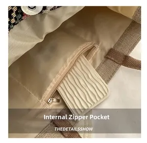 Detail shot of canvas tote interior featuring a metal zipper pocket and fabric lining