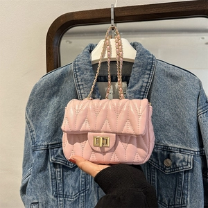 Pink quilted shoulder bag with V-shaped stitching and golden metal chain strap