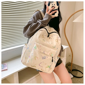 Detail of white printed backpack with colorful splash ink and side water bottle pocket