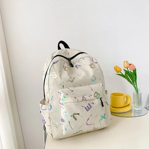 Detail of cream backpack with colorful ink splashes and holographic letter prints