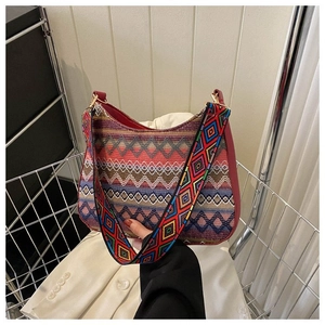 Close-up of bohemian geometric jacquard bag with ethnic woven wide shoulder strap