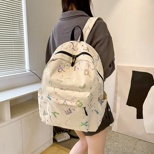 Minimalist cream backpack with colorful letter print and large capacity for travel