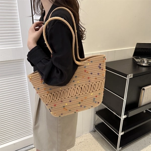 Chic woven tote beach bag in beige with colorful specks and wavy 3D knit details