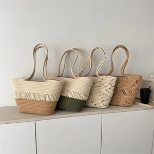 Handwoven straw bucket bags in multiple colors featuring unique wavy knit textures