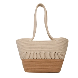 Two-tone woven straw shoulder bag with beige and brown patterns for beach and summer style