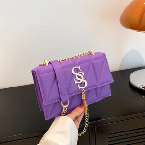 Fashionable purple quilted chain shoulder bag with gold tassel detail and leather strap