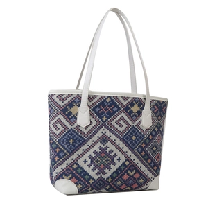 Ethnic style woven tote bag with colorful geometric patterns and white faux leather straps