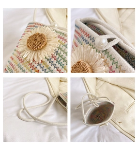 Détails du mini sac en paille fait main avec marguerite décorative et fermoir perle