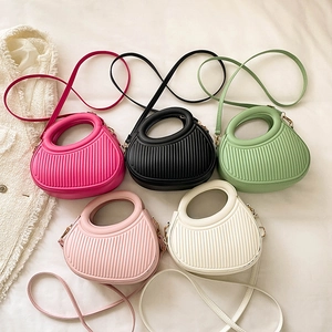Fashionable PU leather round bags with pleated texture and hollow circular handles