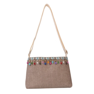 Sac bandoulière tissé de style ethnique avec motifs géométriques et détails de glands