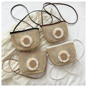 Straw mini bucket bags with daisy decor in black, chocolate, tan, and cream variants