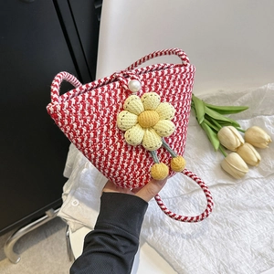 Handmade red and white woven bucket mini bag with floral accents and pearl clasp