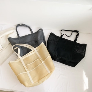 Large mesh beach tote bag with pockets in black, grey and beige colors for women
