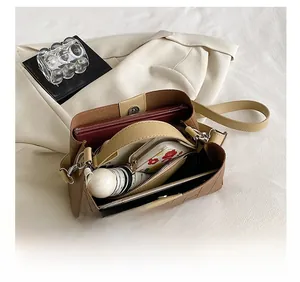 Interior view of brown crocodile pattern shoulder bag showing spacious storage capacity