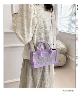 Detail of purple handbag with sparkling rhinestones and versatile crossbody shoulder strap