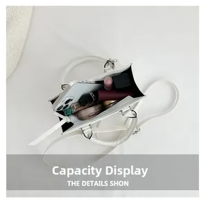 Internal view of a white PU leather handbag showing storage capacity for cosmetics