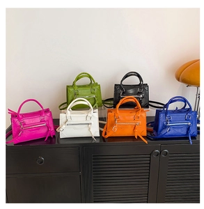 Detailed collection of mini leather handbags in six vibrant colors with tassel zippers